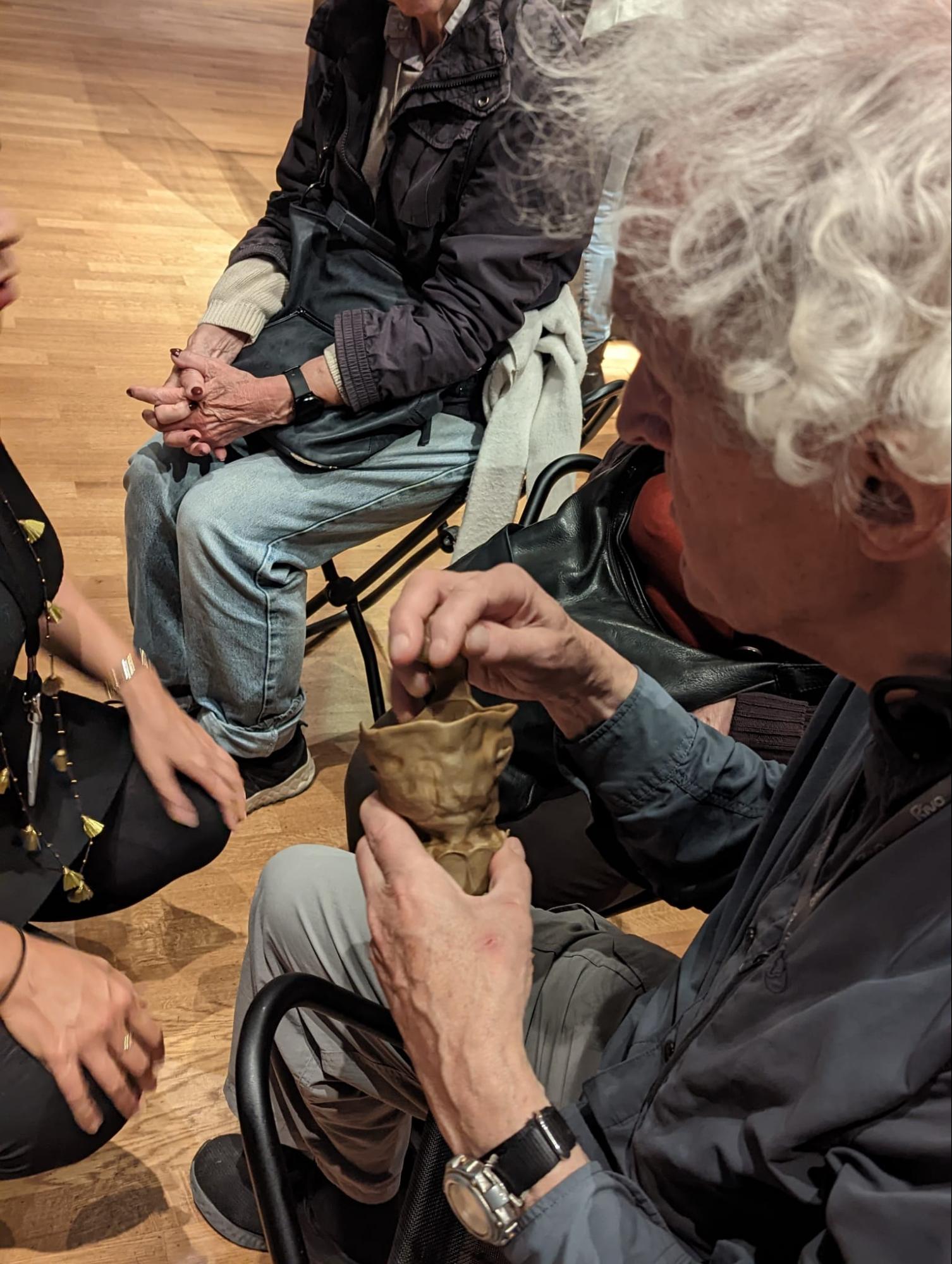 Tactile Lidded Ewer - angled view showing the relationship of men and nature theme